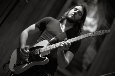 Garrett Mann from Statesboro Revue (Blues Garage, 2015) / Performance  photography by Photographer xprssnst | STRKNG