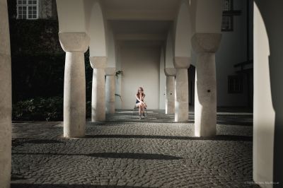 Young woman between old columns / Portrait  photography by Photographer Gerfried Reis ★1 | STRKNG